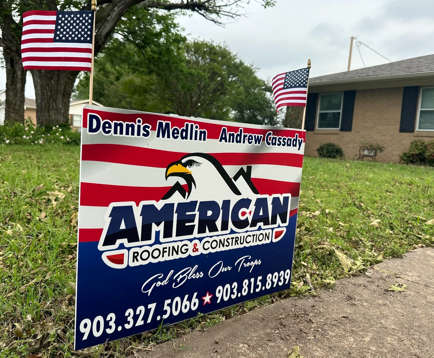 American Roofing & Construction yard sign at a local property